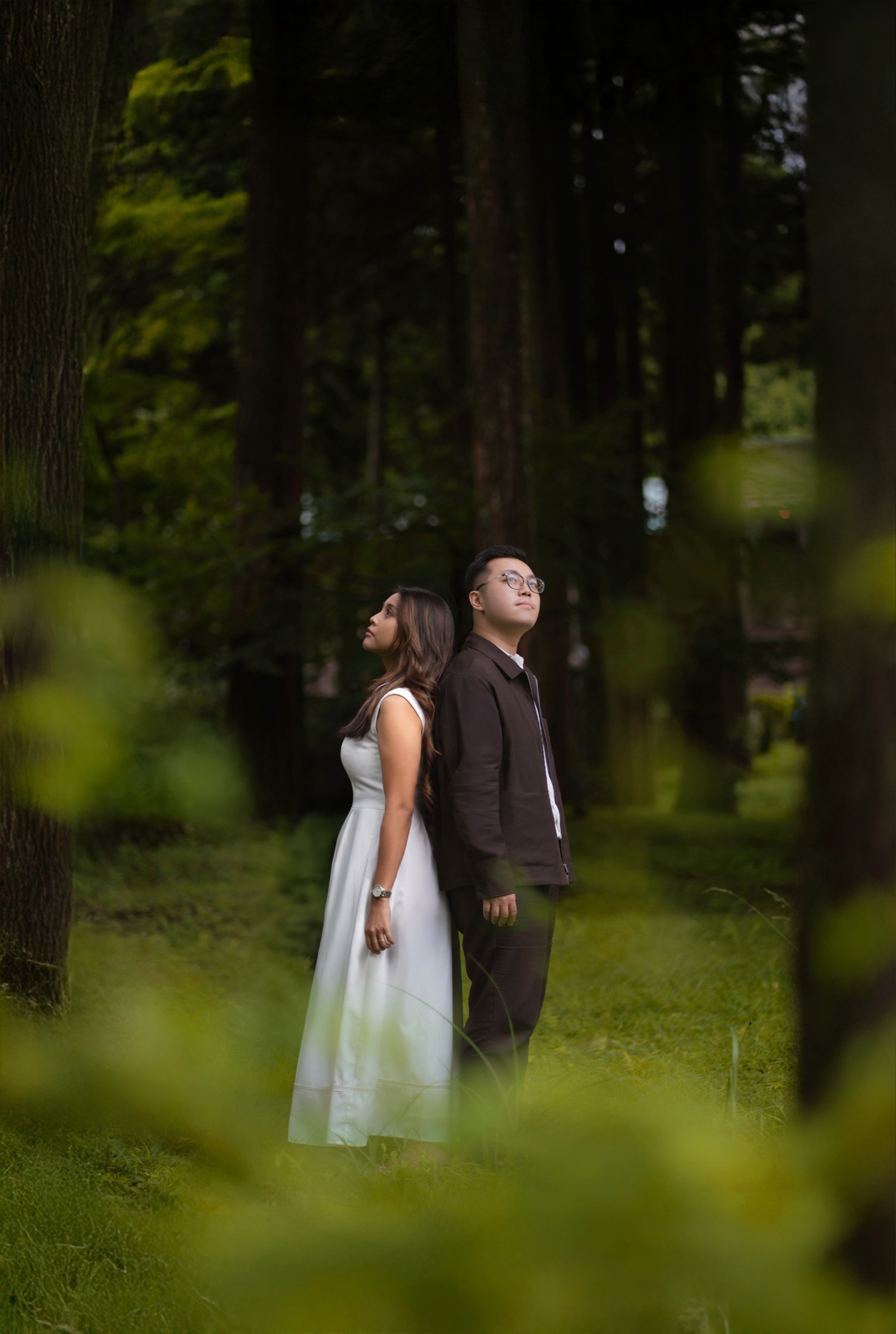 Declann and Afrina among tall trees